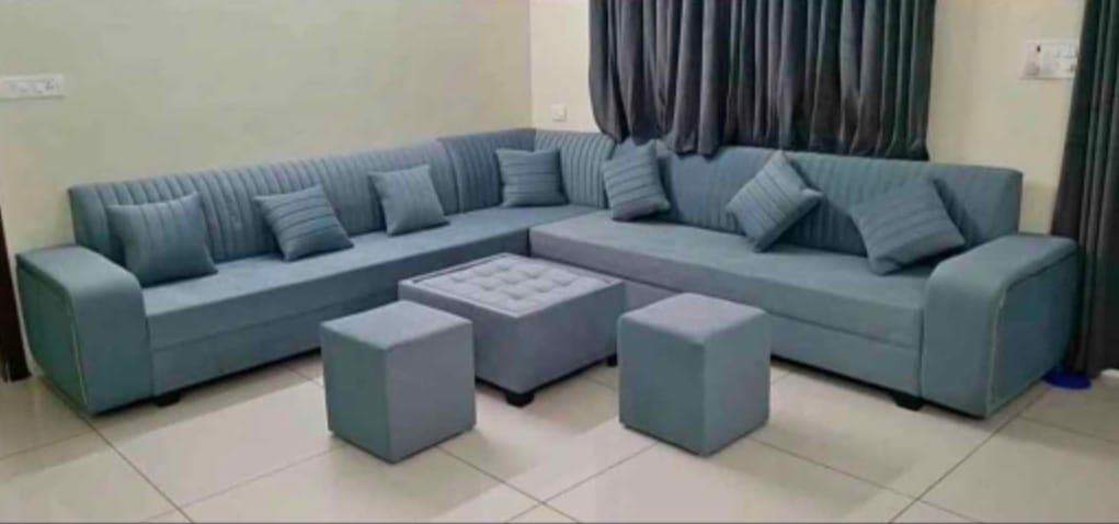 Blue-grey L-shape sofa with puffies